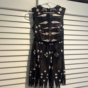 BCBG short dress with sheer chest panel. Size 0